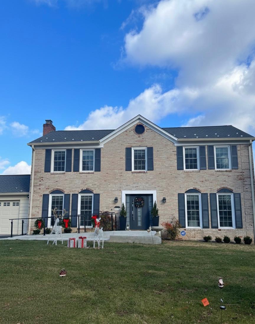 Elegant brick house exterior with festive decorations